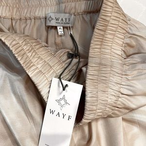 Elastic waste, cream colored, wide leg pants.